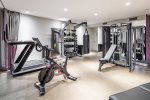 Spacious gym area w/ dumbells, pulley machine, and more Located off the master bathroom